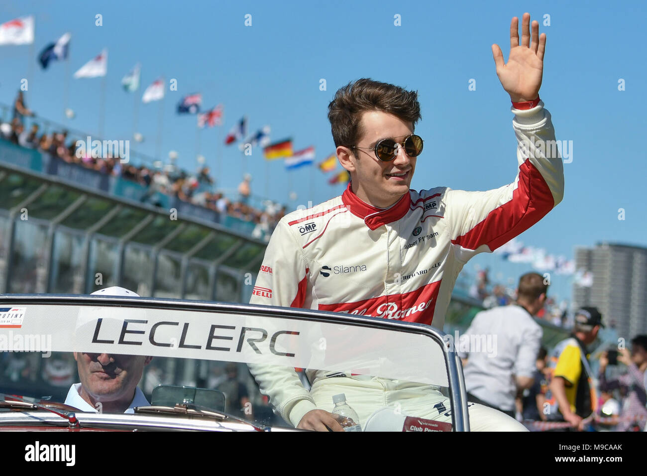 Albert Park, Melbourne, Australia. 25th Mar, 2018. Charles Leclerc (MCO) #16 from the Alfa Romeo Sauber F1 Team waves to the crowd during the drivers' parade at the 2018 Australian Formula One Grand Prix at Albert Park, Melbourne, Australia. Sydney Low/Cal Sport Media/Alamy Live News Stock Photo