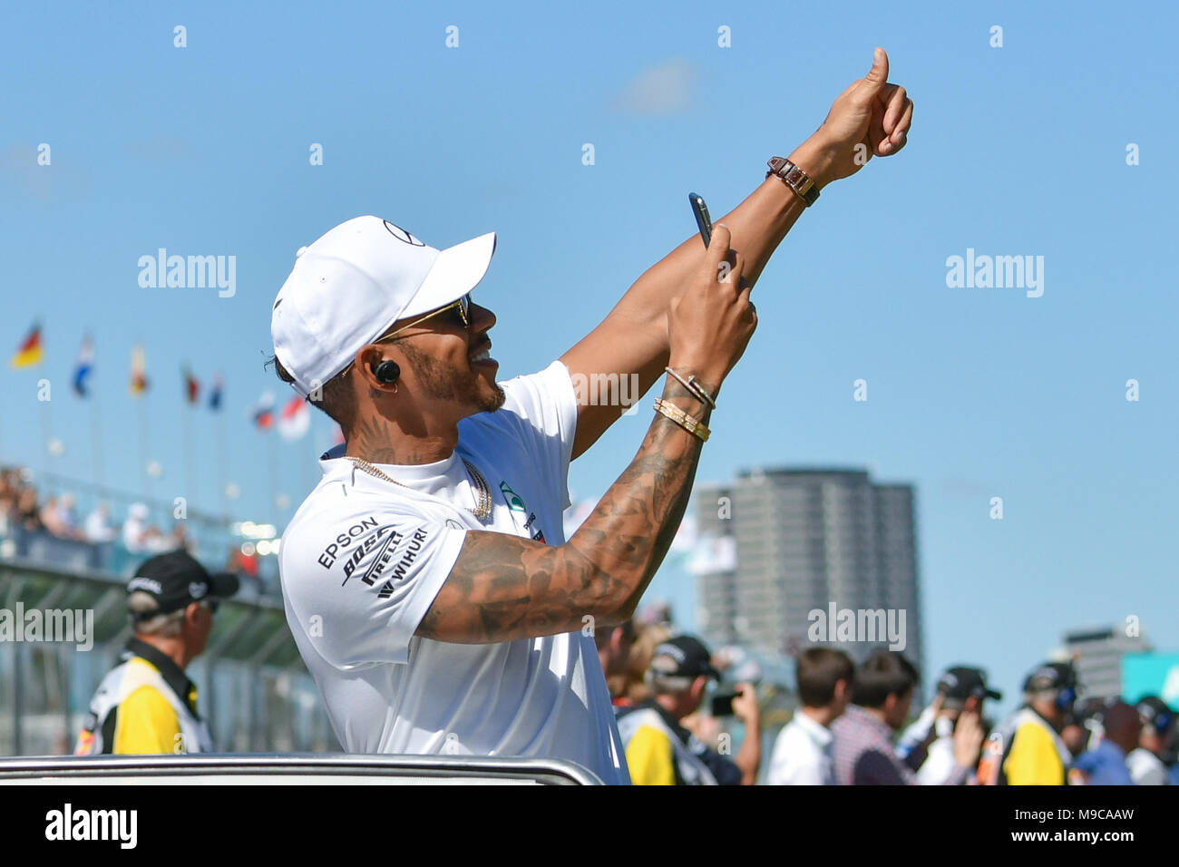 Albert Park, Melbourne, Australia. 25th Mar, 2018. Lewis Hamilton (GBR) #44 from the Mercedes AMG Petronas Motorsport team waves to the crowd during the drivers' parade at the 2018 Australian Formula One Grand Prix at Albert Park, Melbourne, Australia. Sydney Low/Cal Sport Media/Alamy Live News Stock Photo