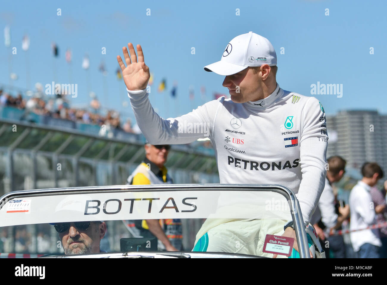 Albert Park, Melbourne, Australia. 25th Mar, 2018. Valtteri Bottas (FIN) #77 from the Mercedes AMG Petronas Motorsport team waves to the crowd during the drivers' parade at the 2018 Australian Formula One Grand Prix at Albert Park, Melbourne, Australia. Sydney Low/Cal Sport Media/Alamy Live News Stock Photo