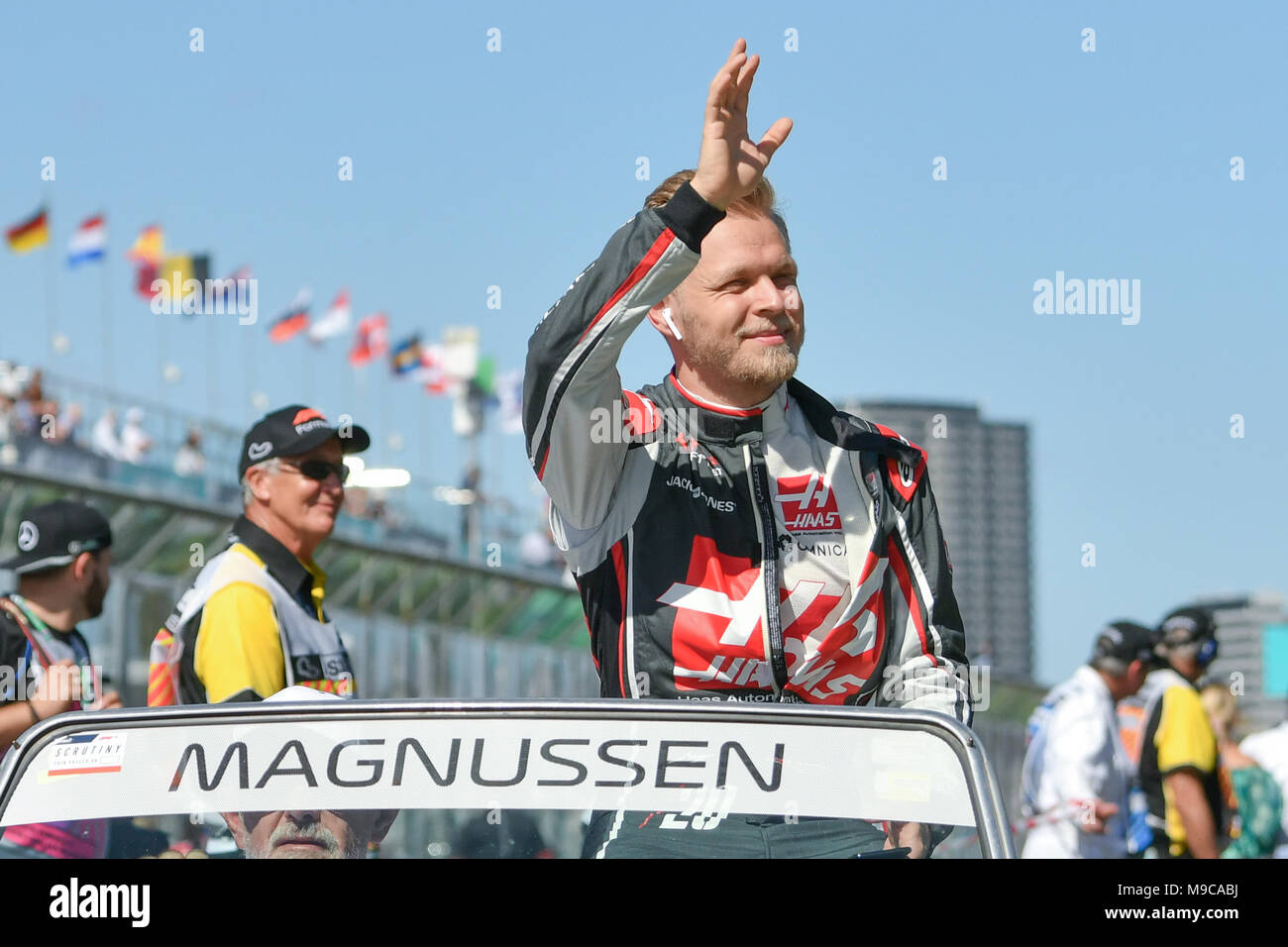 Albert Park, Melbourne, Australia. 25th Mar, 2018. Kevin Magnussen (DEN) #20 from the Haas F1 Team waves to the crowd during the drivers' parade at the 2018 Australian Formula One Grand Prix at Albert Park, Melbourne, Australia. Sydney Low/Cal Sport Media/Alamy Live News Stock Photo