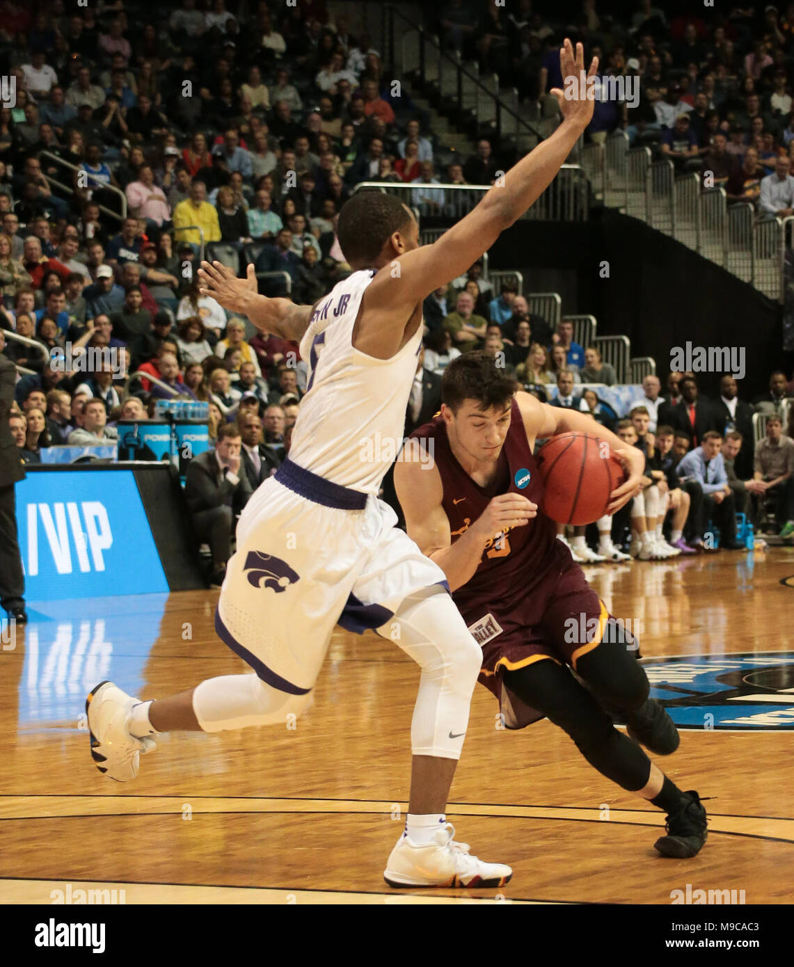 ATLANTA - MAR 24: Loyola-Chicago Ramblers guard Ben Richardson (14) drives past Kansas State Wildcats guard Barry Brown Jr. (5) during the Elite 8 game at Philips Arena on March 24, 2018 in Atlanta, Georgia. Loyola-Chicago won 78-62 to advance to the Final Four. Stock Photo