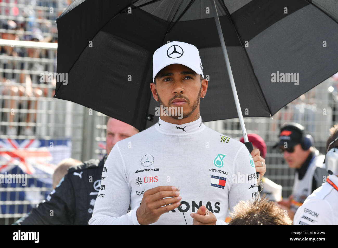 Albert Park, Melbourne, Australia. 25th Mar, 2018. Lewis Hamilton (GBR) #44 from the Mercedes AMG Petronas Motorsport team prepares to put on his race suit on the grid prior to the start of the 2018 Australian Formula One Grand Prix at Albert Park, Melbourne, Australia. Sydney Low/Cal Sport Media/Alamy Live News Stock Photo