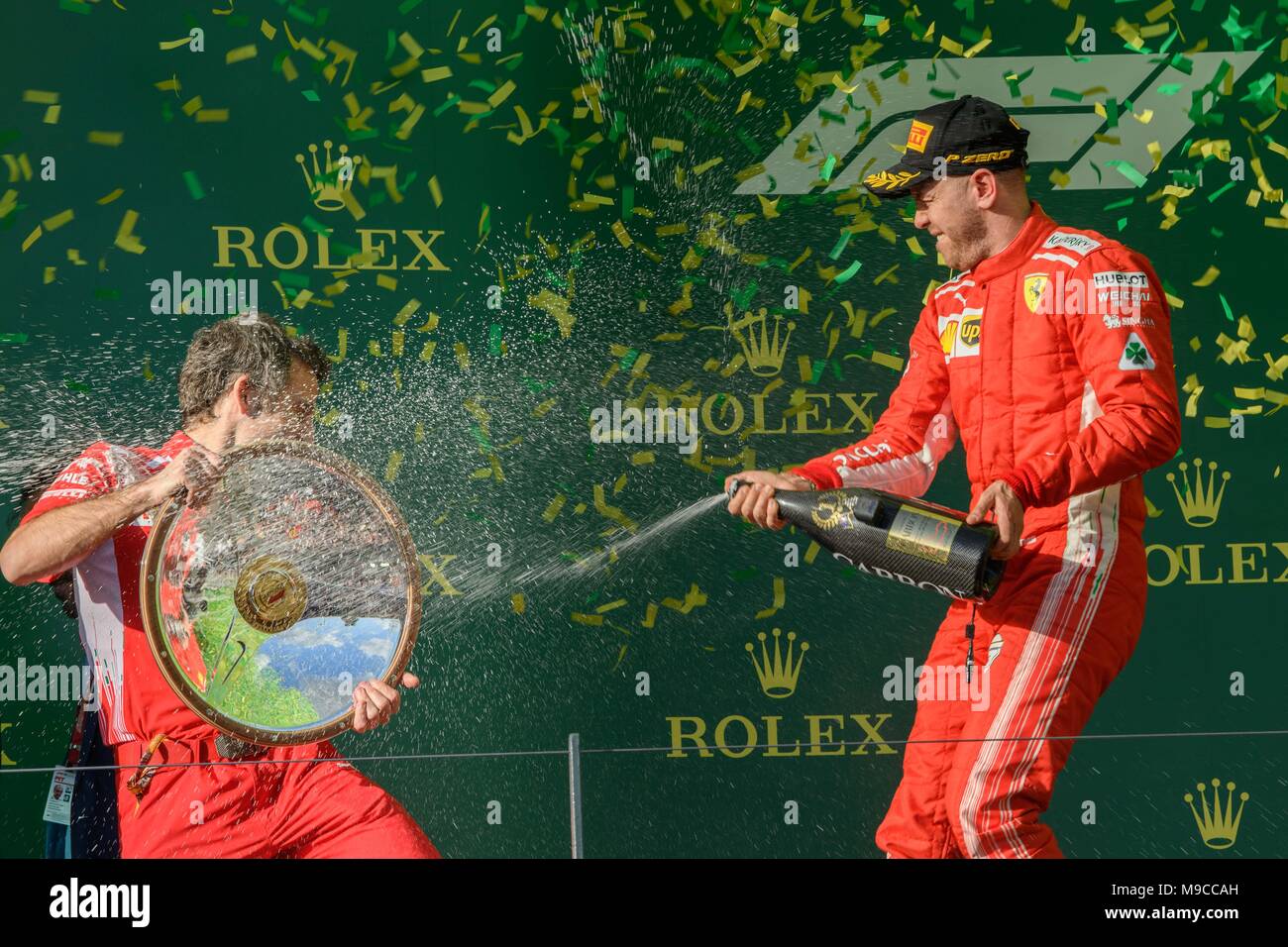 Albert Park, Melbourne, Australia. 25th Mar, 2018. Sebastian Vettel (DEU) #5 from the Scuderia Ferrari team celebrates after winning the 2018 Australian Formula One Grand Prix at Albert Park, Melbourne, Australia. Lewis Hamilton (GBR) #44 from the Mercedes AMG Petronas Motorsport team came second and Sebastian Vettel (DEU) #5 from the Scuderia Ferrari team came third. Sydney Low/Cal Sport Media/Alamy Live News Stock Photo