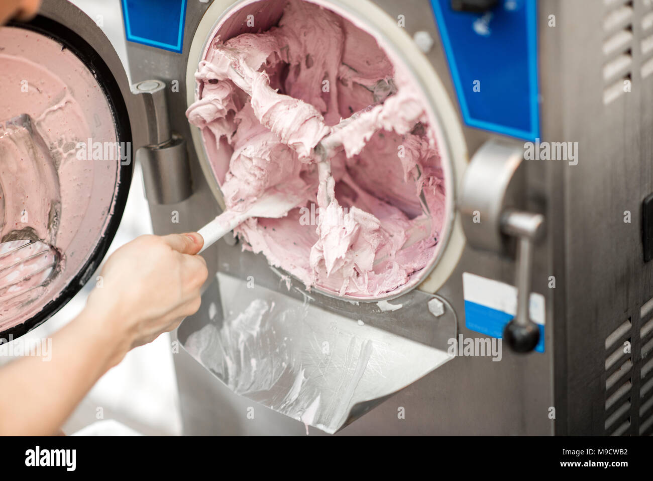 Cleaning ice cream maker machine Stock Photo