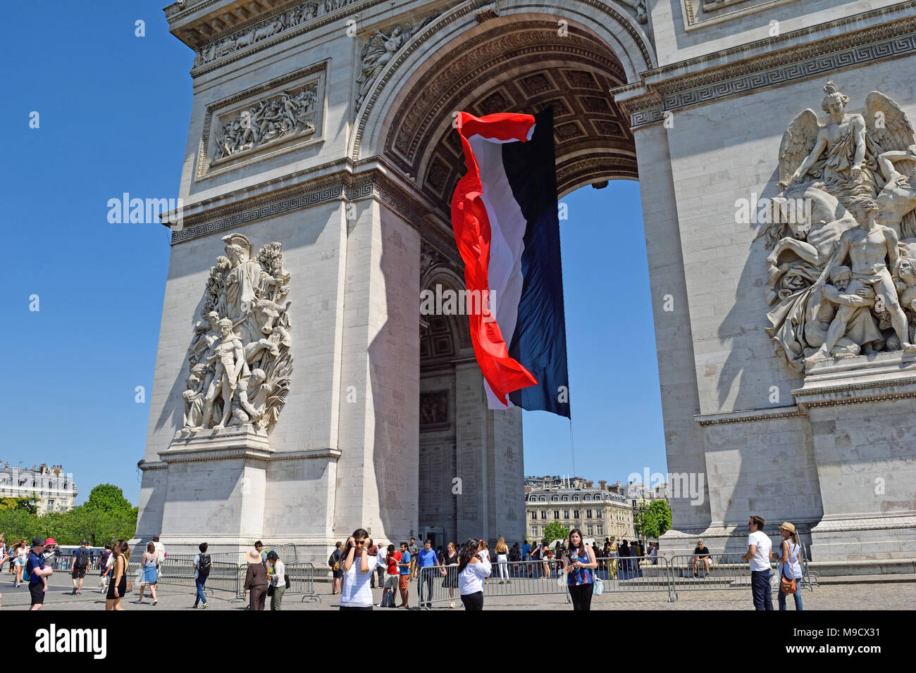 Paris, France. June 18, 2017. The French flag blowing in the wind under the Arch de Triumph in Paris Stock Photo