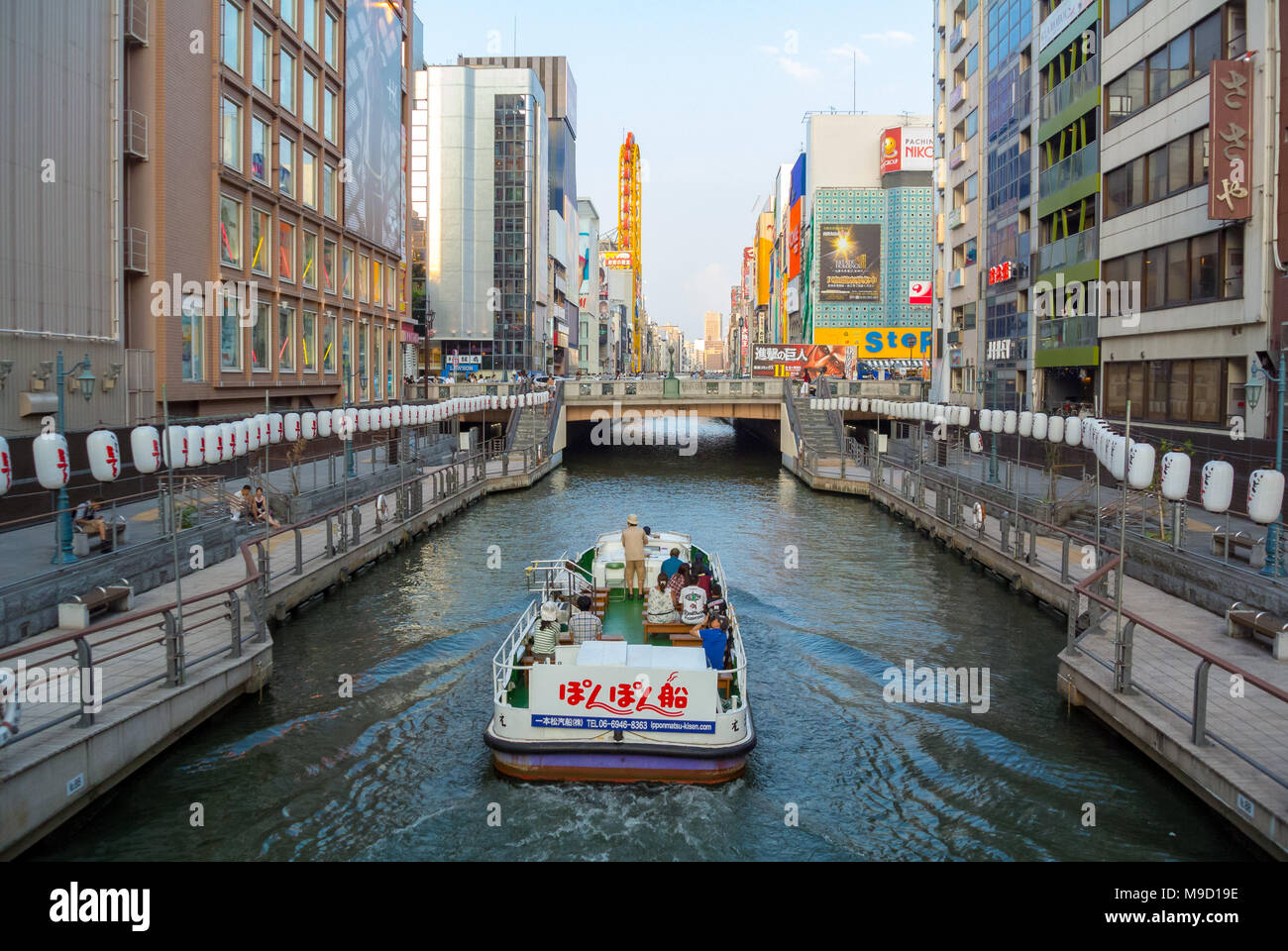 Tourists doing a cruise on canal, osaka, japan Stock Photo