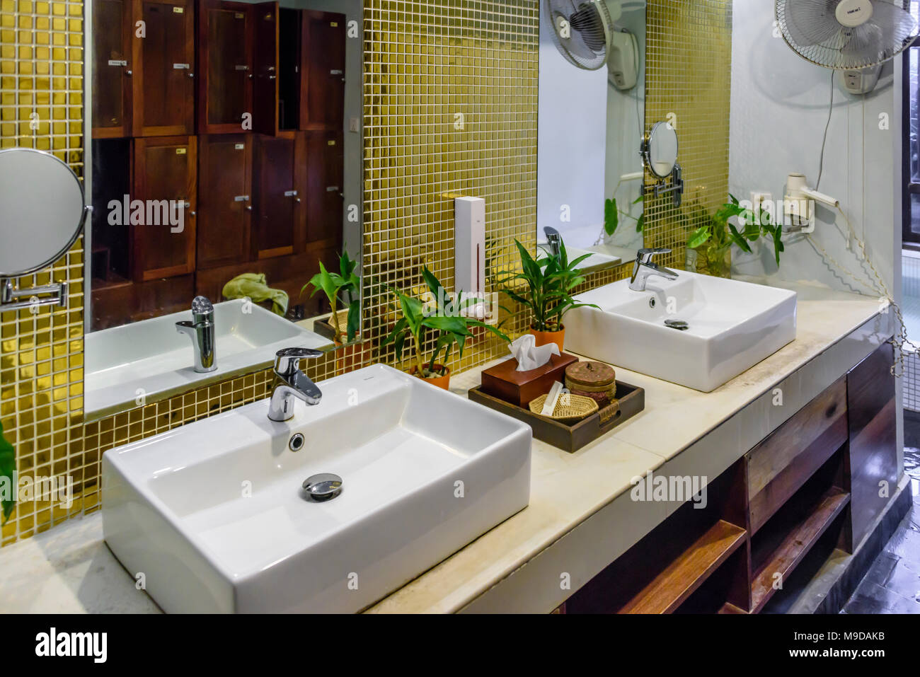 Sinks Mirrors And Glass Wall Tiles In The Changing Room Of