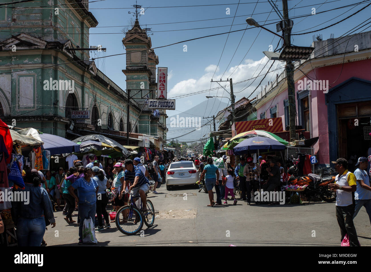The vibrant municipal market with Mombacho volcano in the background in Granada, Nicaragua Stock Photo