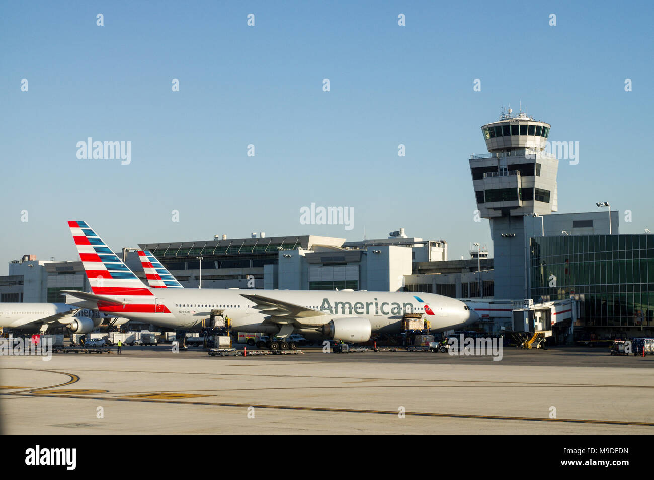 American Airlines aircraft in front of the old tower at Miami International Airport Stock Photo