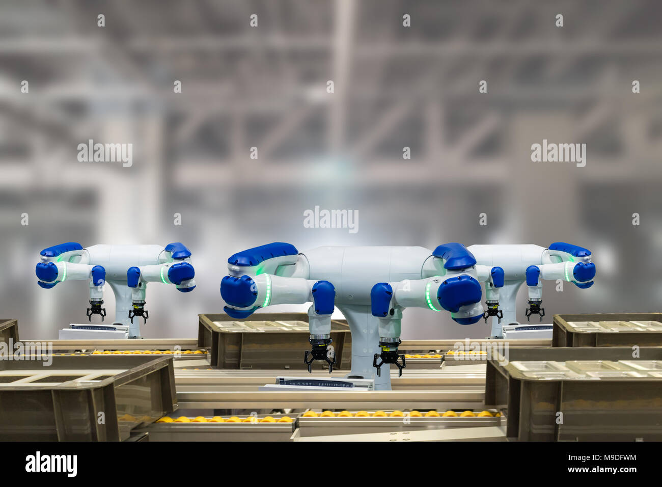 iot industry 4.0 technology concept.Smart factory using trending automation robotic arms with empty conveyor belt in operation line. Automotive manufa Stock Photo