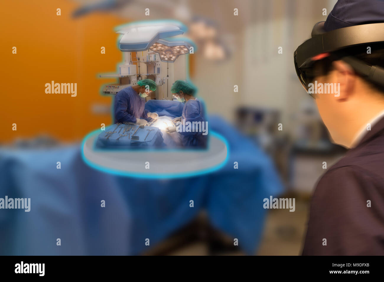 Smart medical technology robot concept, Doctor(blurred) use augmented mixed virtual reality technology in operation room to see the autonomous robotic Stock Photo
