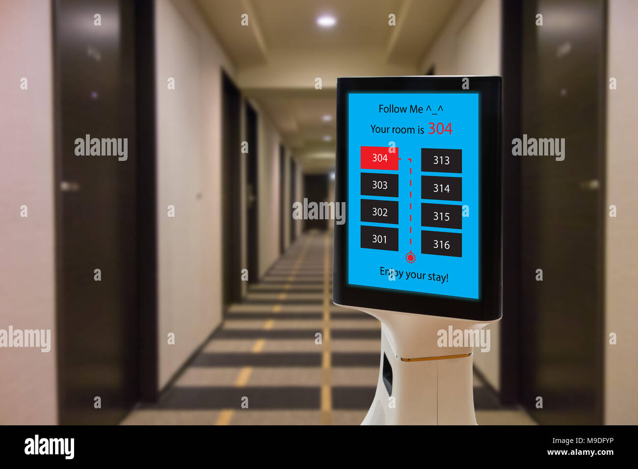 robot in hotel concept, robotic butler help the customer to the room that booking, put the object, food, accessories inside it. Stock Photo