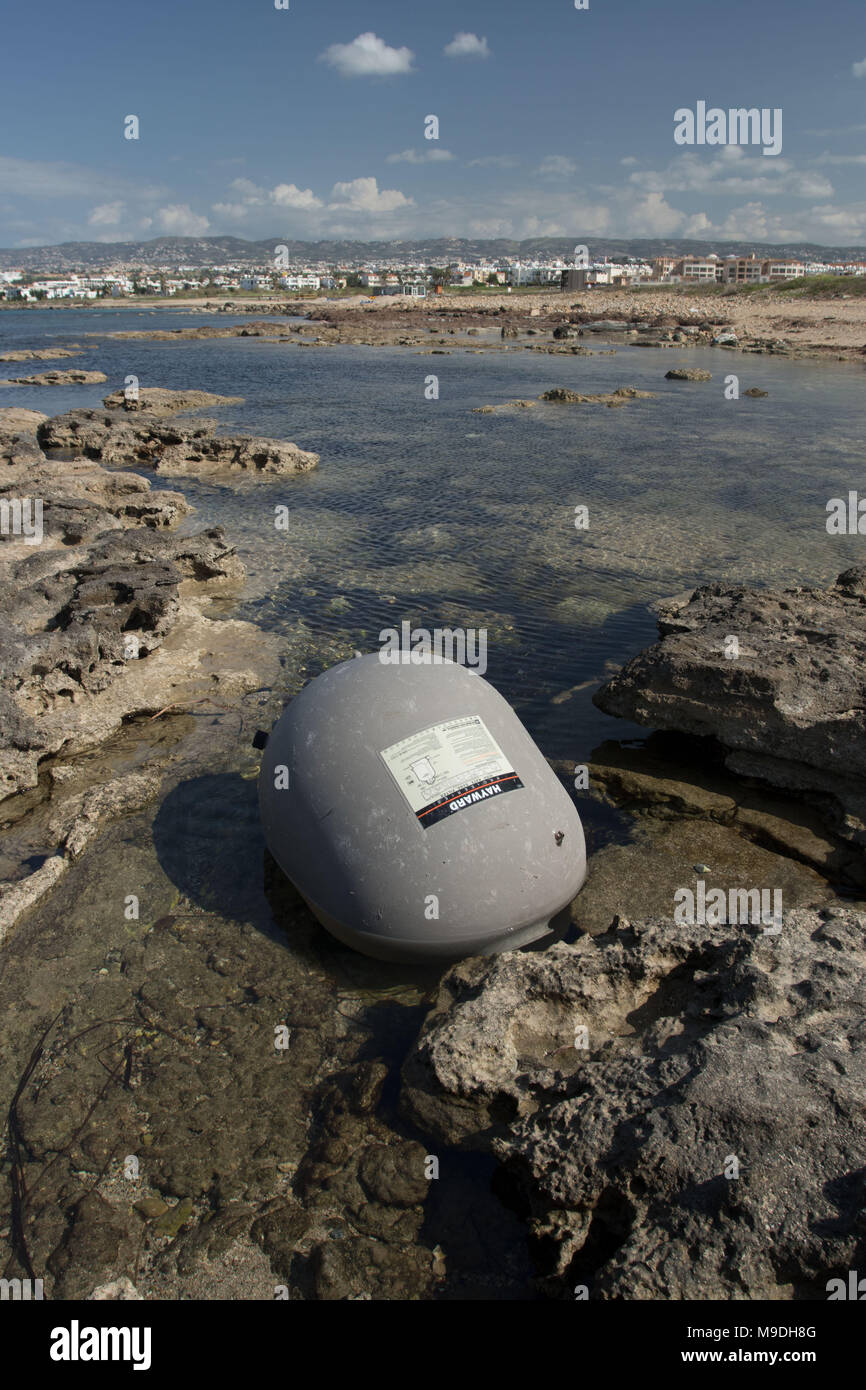 Large environmentally unfriendly plastic refuse ball on the beautiful mediterranean coast at paphos, cyprus, europe Stock Photo