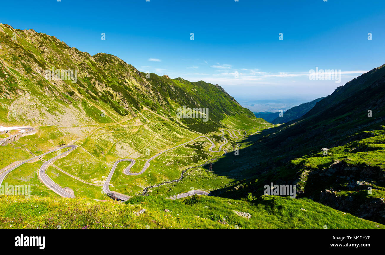 transfagarasan road in mountains of Romania. gorgeous view of the landscape from the edge of a hill. serpentine road with lots of turnarounds is windi Stock Photo