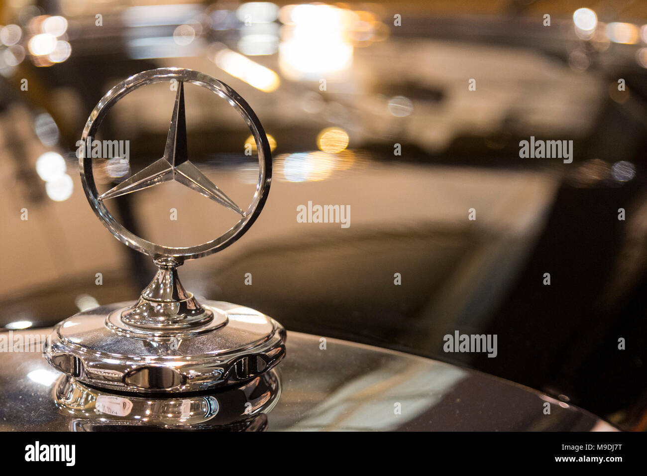 Mercedes-Benz star, hood ornament. Techno-Classica Essen is the world leading automobile show for classic and vintage cars and collectible automobiles. In 2018, the motor show attracted over 185,000 visitors. More than 1,250 exhibitors from over 30 countries take part. Stock Photo