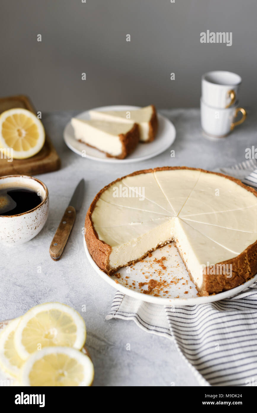 Lemon cheesecake on a table. Sliced lemon cheesecake. Selective focus Stock Photo