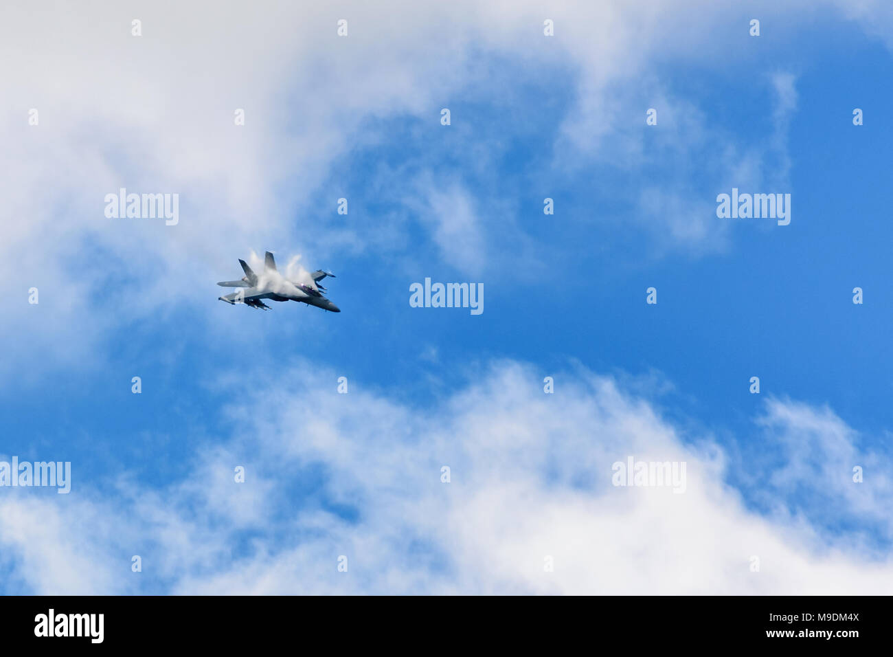 Farnborough Airshow 2016: an F-18 pulls out of a dive showing vortices forming off its wings Stock Photo