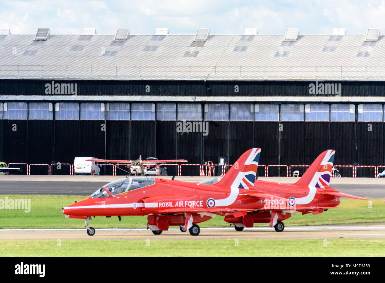 Farnborough Airshow 2016: two red arrows wait on the runway prior to taking off for their display Stock Photo