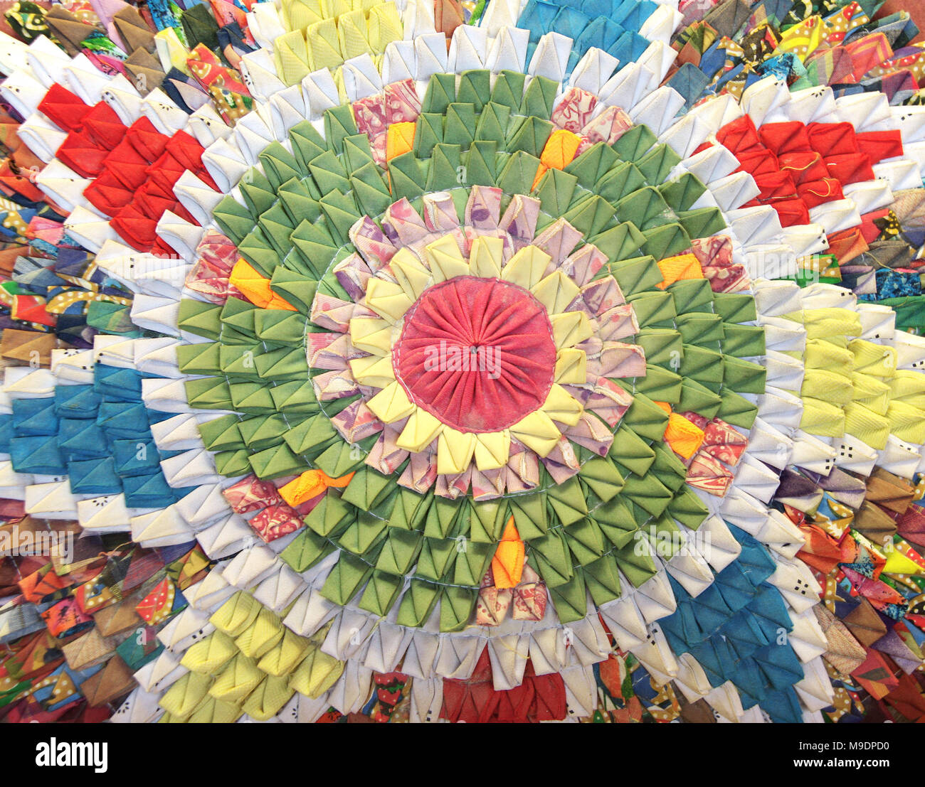 Handmade circular rug with floral pattern in patchwork style. From ...