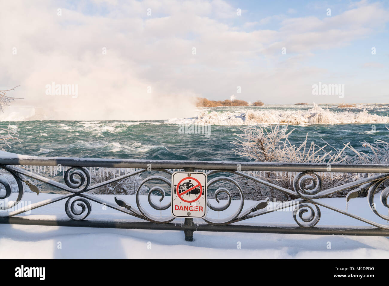Danger sign on frozen railing at Niagara Falls, Canada Stock Photo - Alamy
