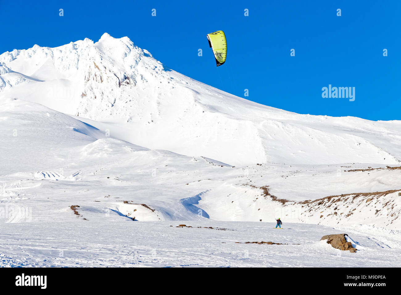 42,779.01062 man kite boarding with a yellow & black sail on Mt Hood, near Government Camp, Oregon, USA Stock Photo