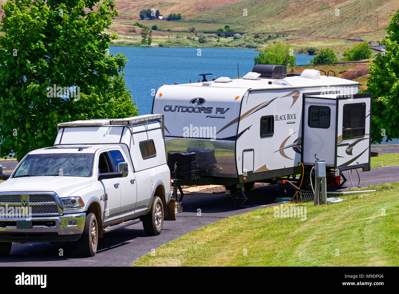 42,903.04270 RAM 2015 pickup truck, 2017 Outdoor RV’s Black Rock camping trailer, Heppner, Oregon RV campground by lake reservoir Stock Photo