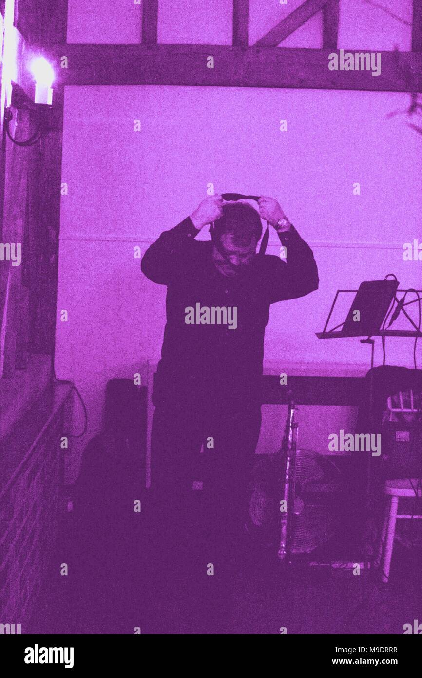 Behind the scenes shot as sax player gets ready for a gig, Essex, UK