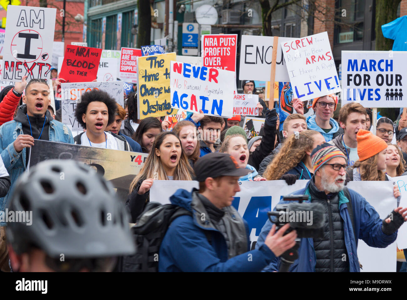 Seattle Washington, March 24th 2018 The March for our Lives rally with many students, children, youth, kids, families, parents and supporters chanting. Stock Photo