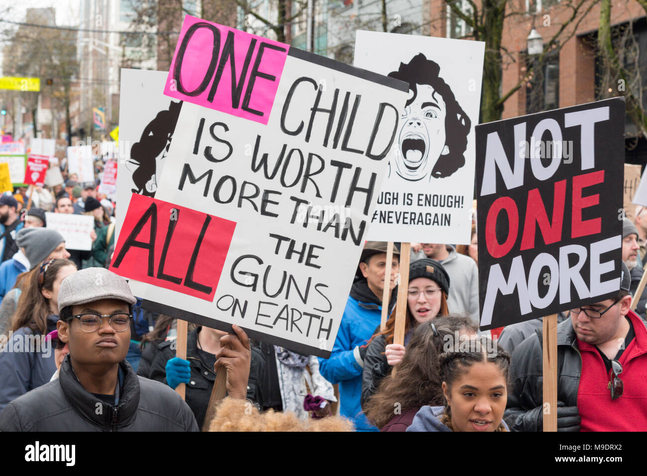 Seattle Washington, March 24th 2018 The March for our Lives rally with many students, children, youth, kids, families, parents and supporters, signs Stock Photo