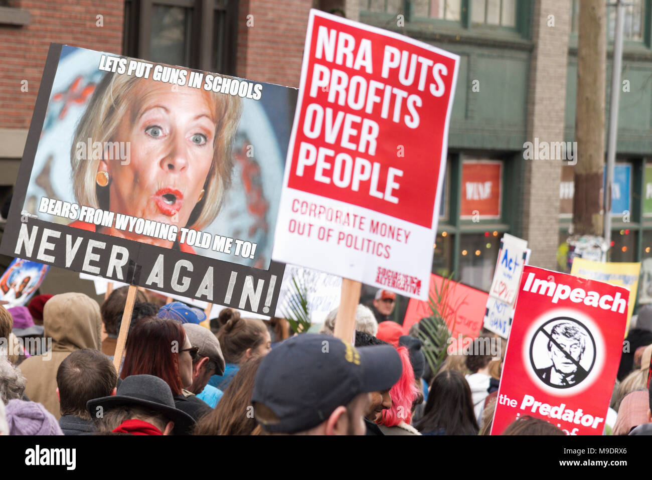 Seattle Washington, March 24th 2018 The March for our Lives rally with many students, children, youth, kids, families, sign with Betsy Devos. Stock Photo