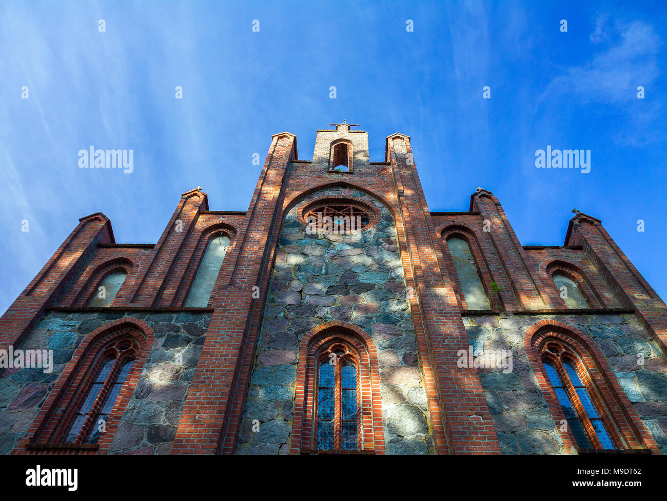 Low shot of All Saints Neo-Gothic church in Stare Drawsko, Poland. Stock Photo