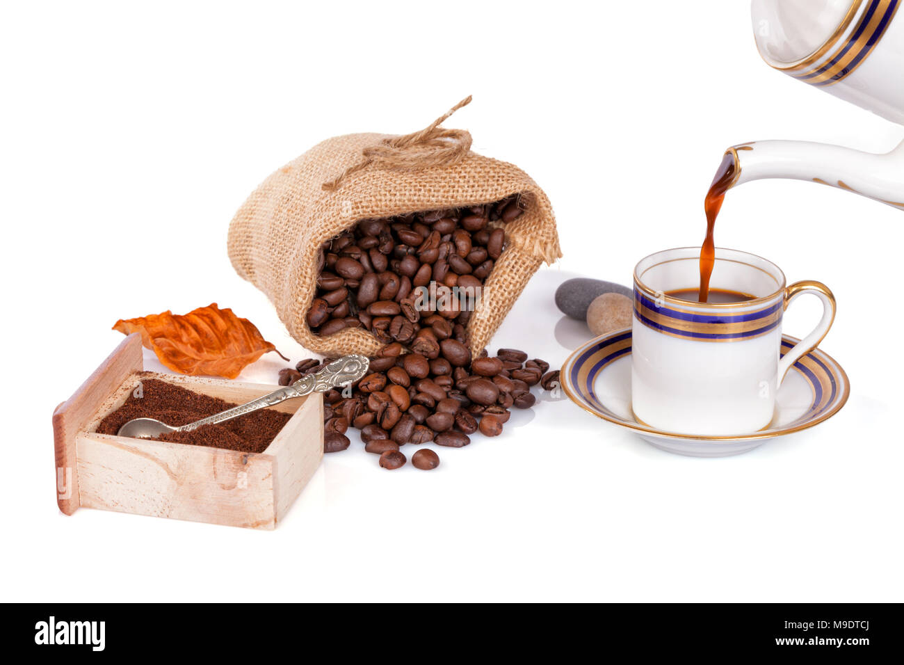 Pouring Coffee In With A Pot An Old Cup Isolated On White Pouring Coffee In With A Pot An Old Cup Isolated On White