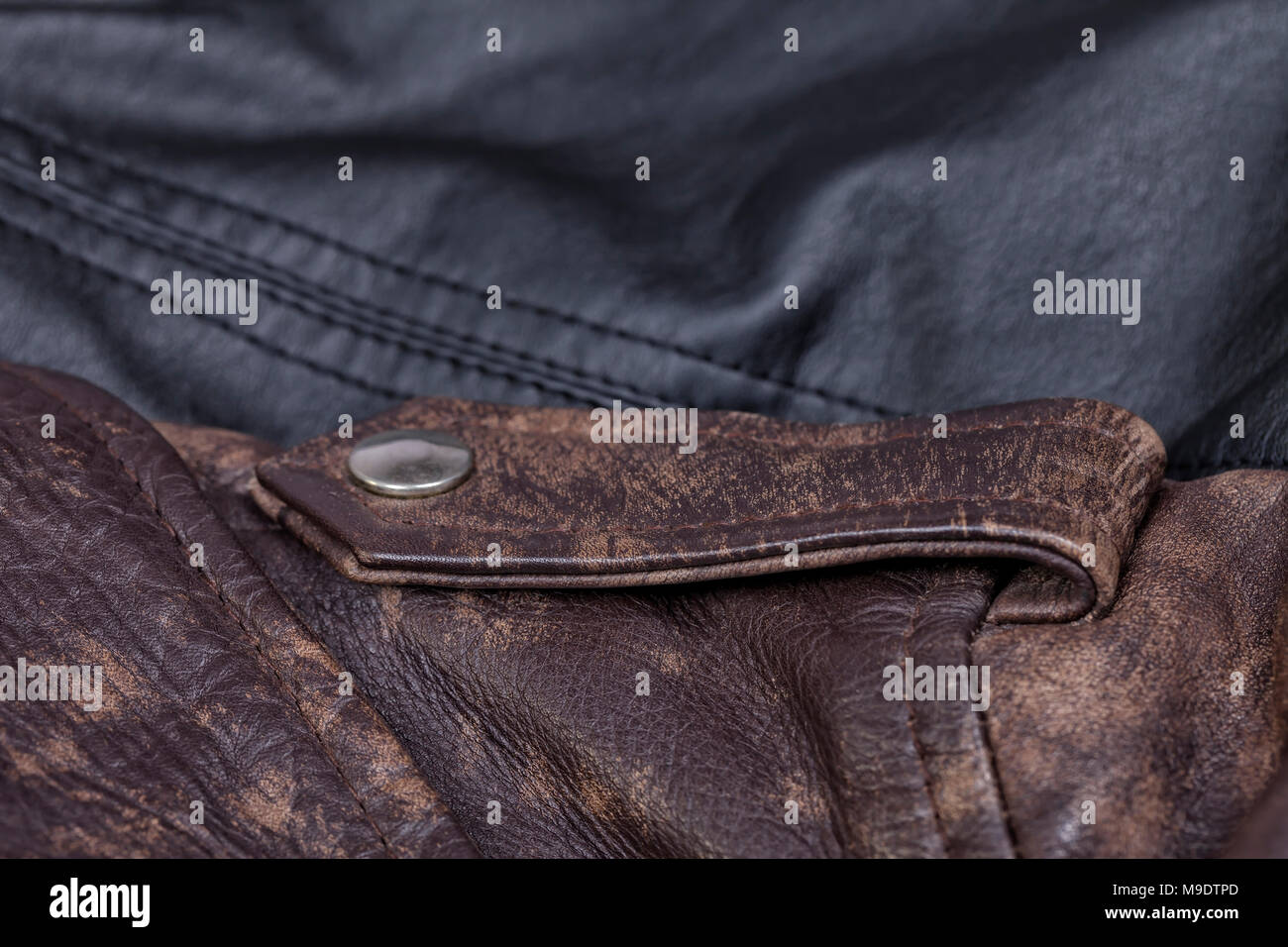 Leather jackets in brown and black colors background. Stock Photo