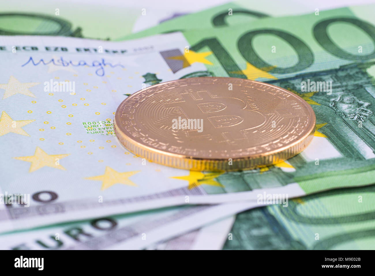 Gold bat against the background of the European currency. The Cryptocurrency  Bitcoin Stock Photo - Alamy