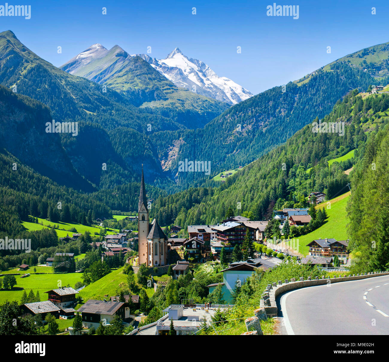 Heiligenblut church in Austria with Grossglockner peak in background Stock Photo