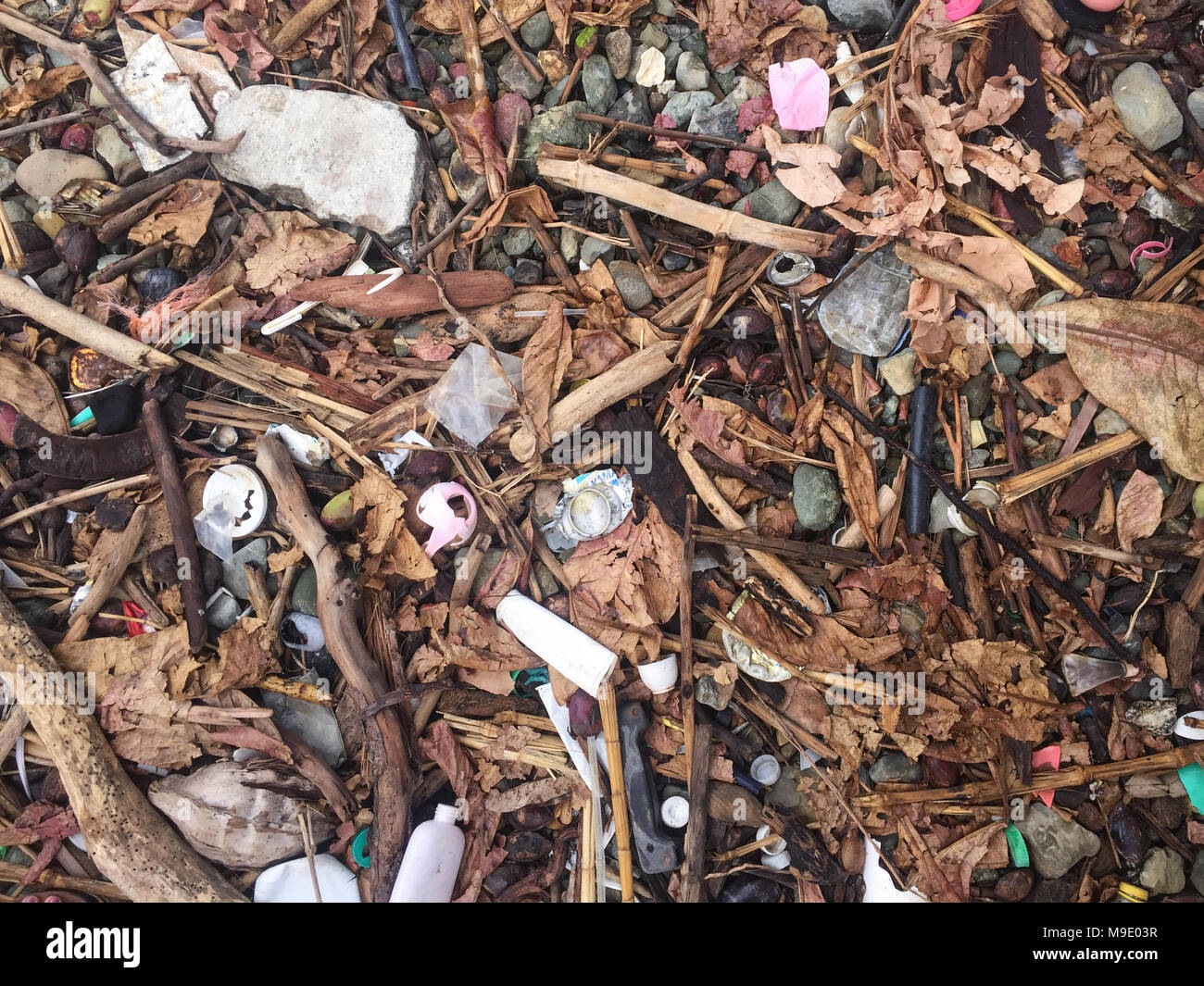 trash on beach, ocean pollution , garbage on coast - Stock Photo