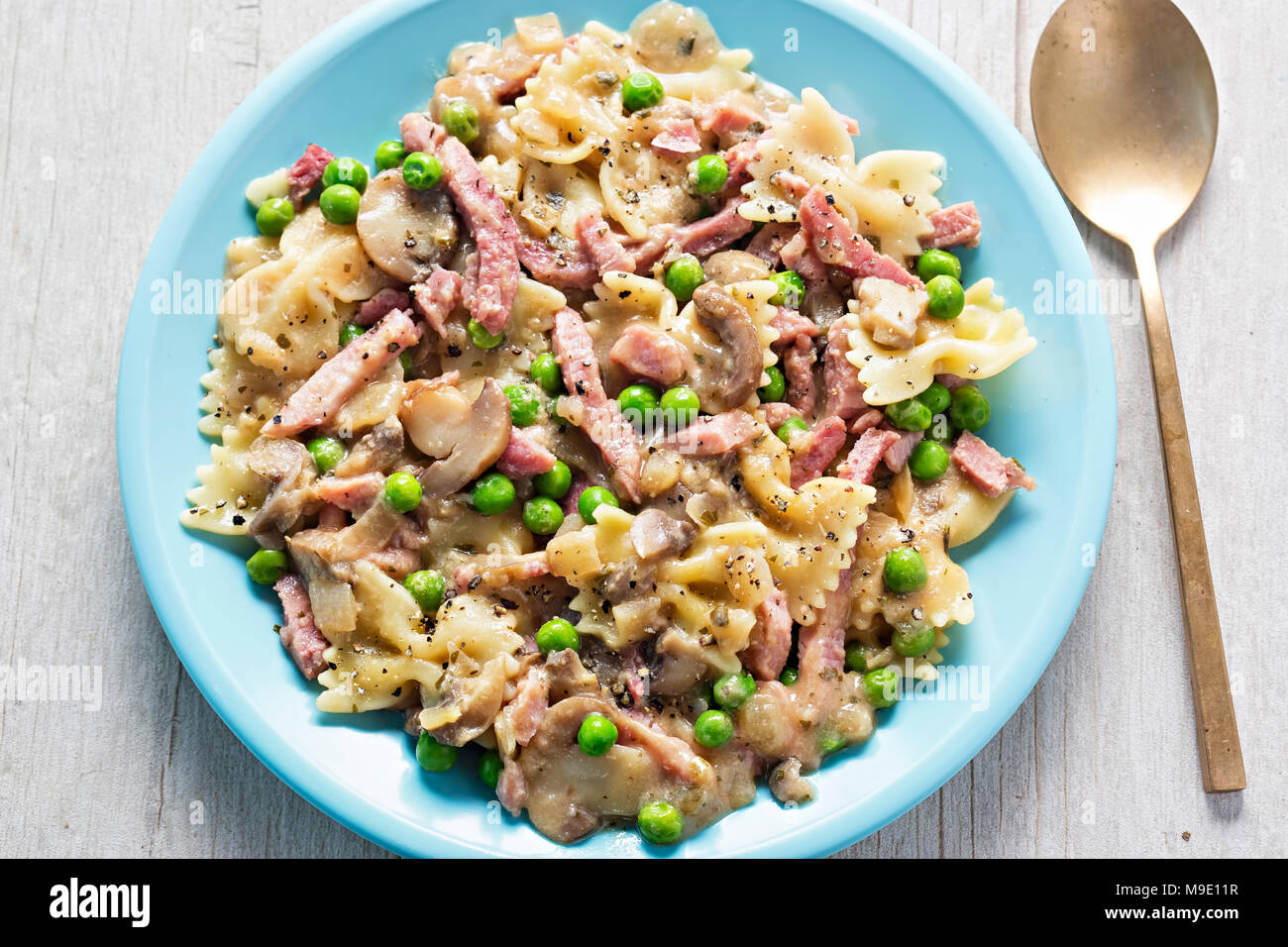 Creamy ham & mushroom farfalle. Pasta carbonara with ham, mushrooms