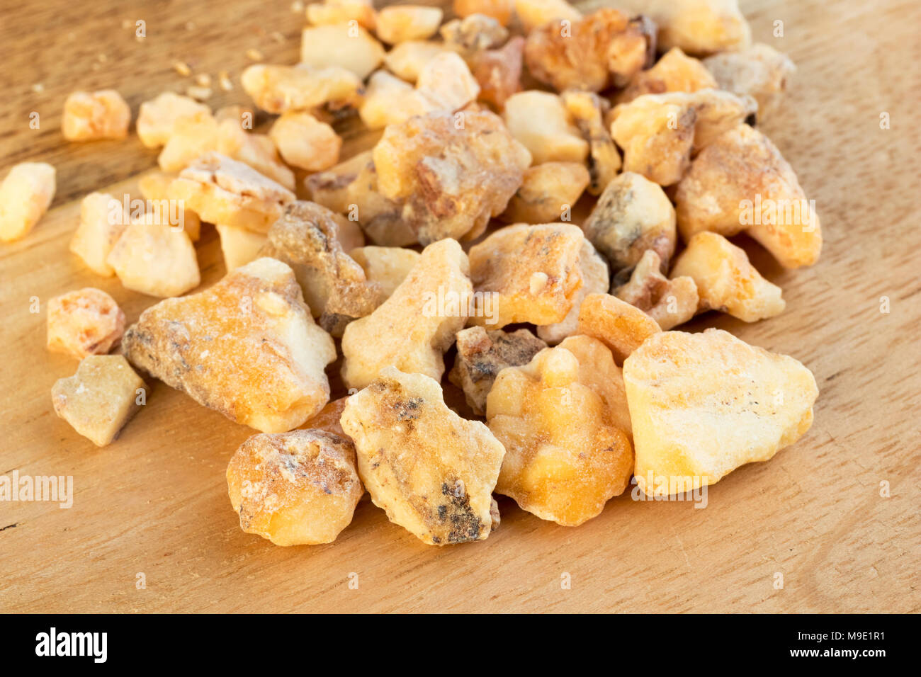 Styrax benzoin resin on a wooden background Stock Photo