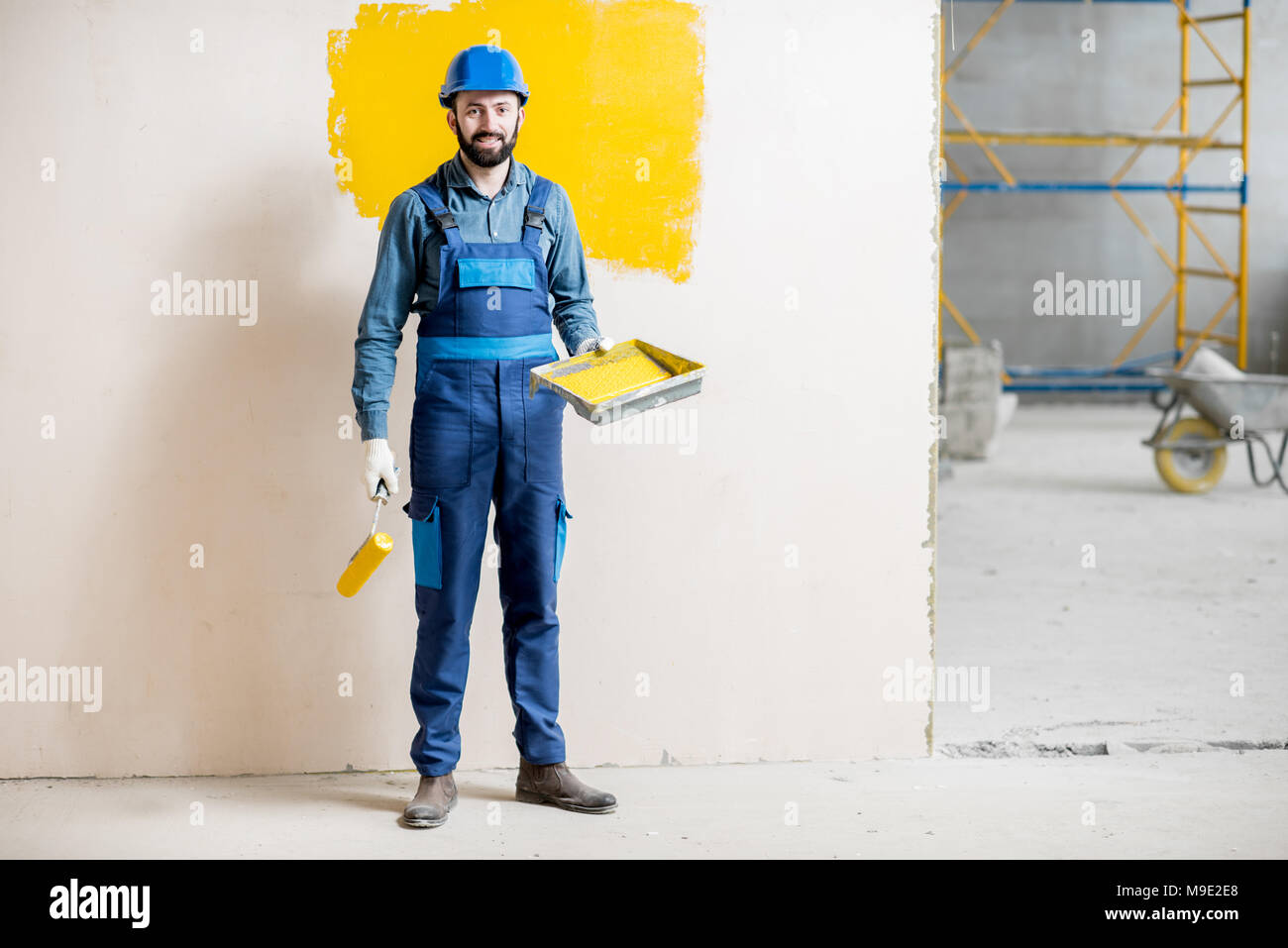 Painter at the construction site Stock Photo