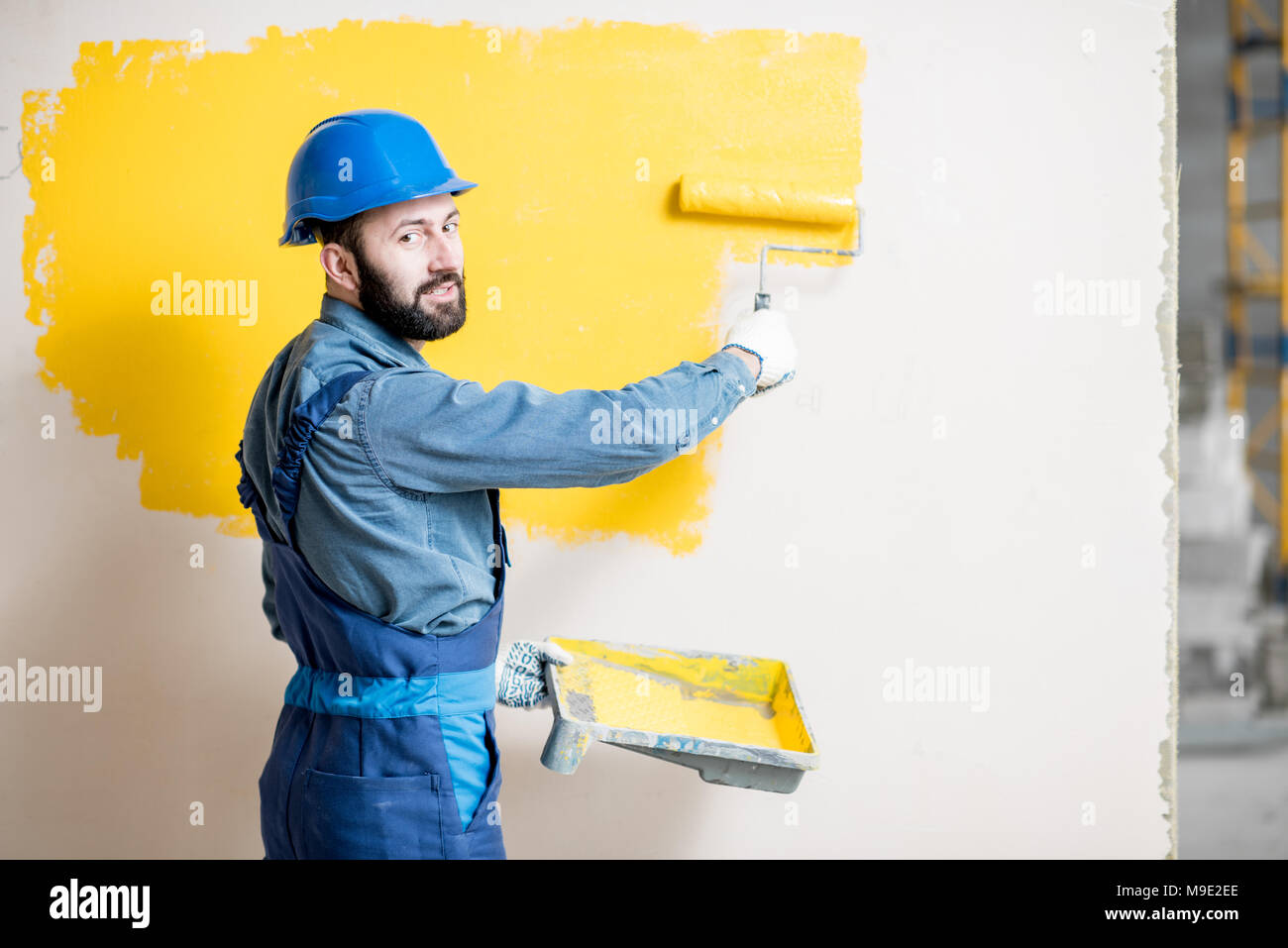 Repairman painting wall Stock Photo Alamy