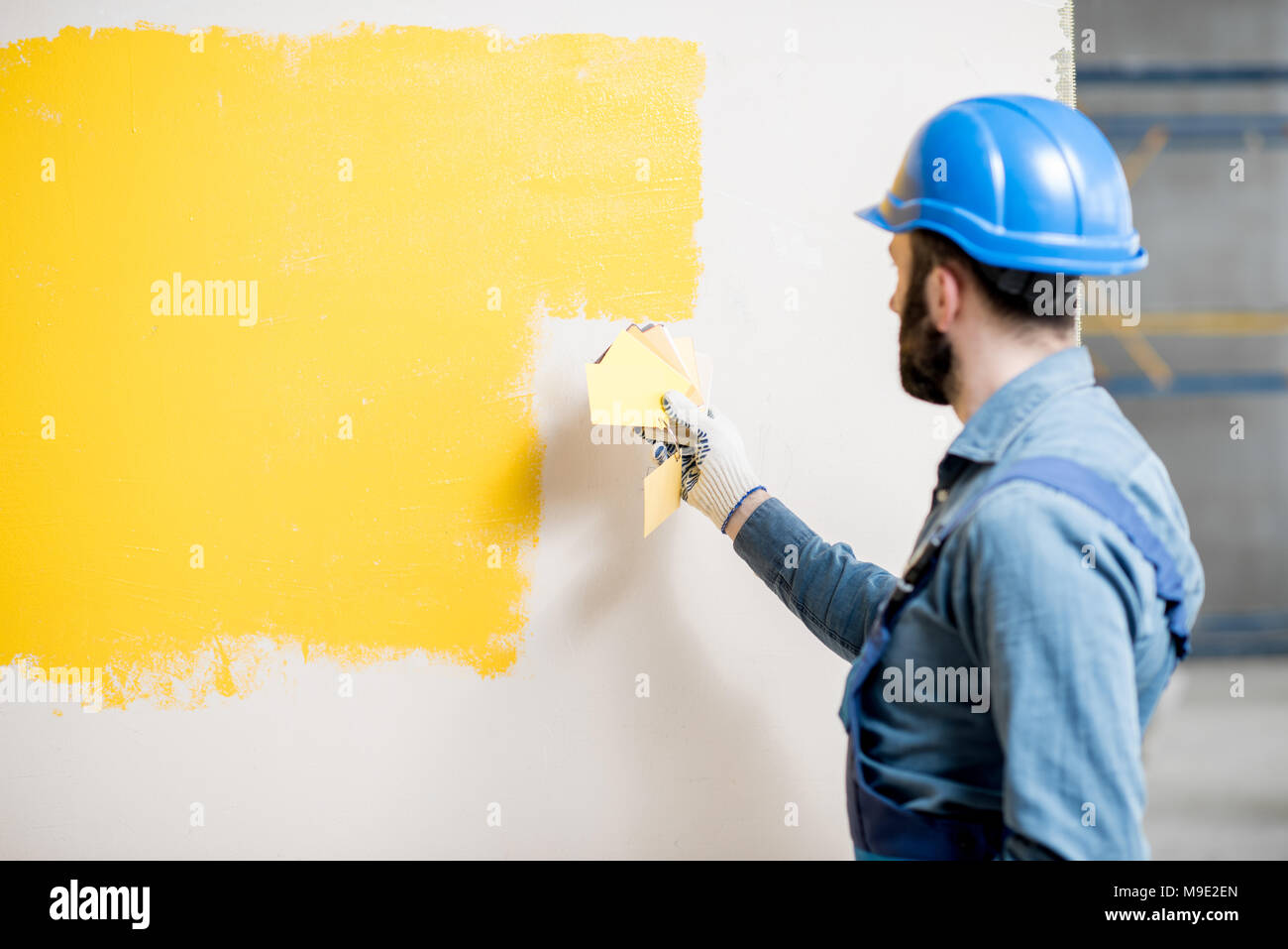 Painter comparing colors Stock Photo - Alamy