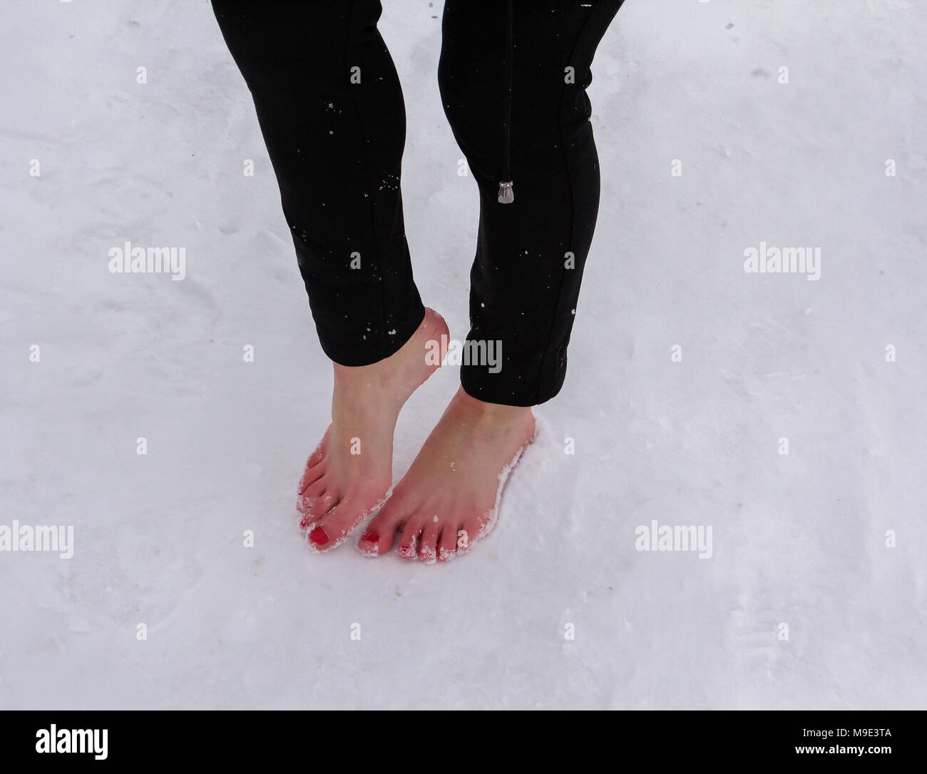 Graceful feet women closeup snow in the winter Stock Photo Alamy