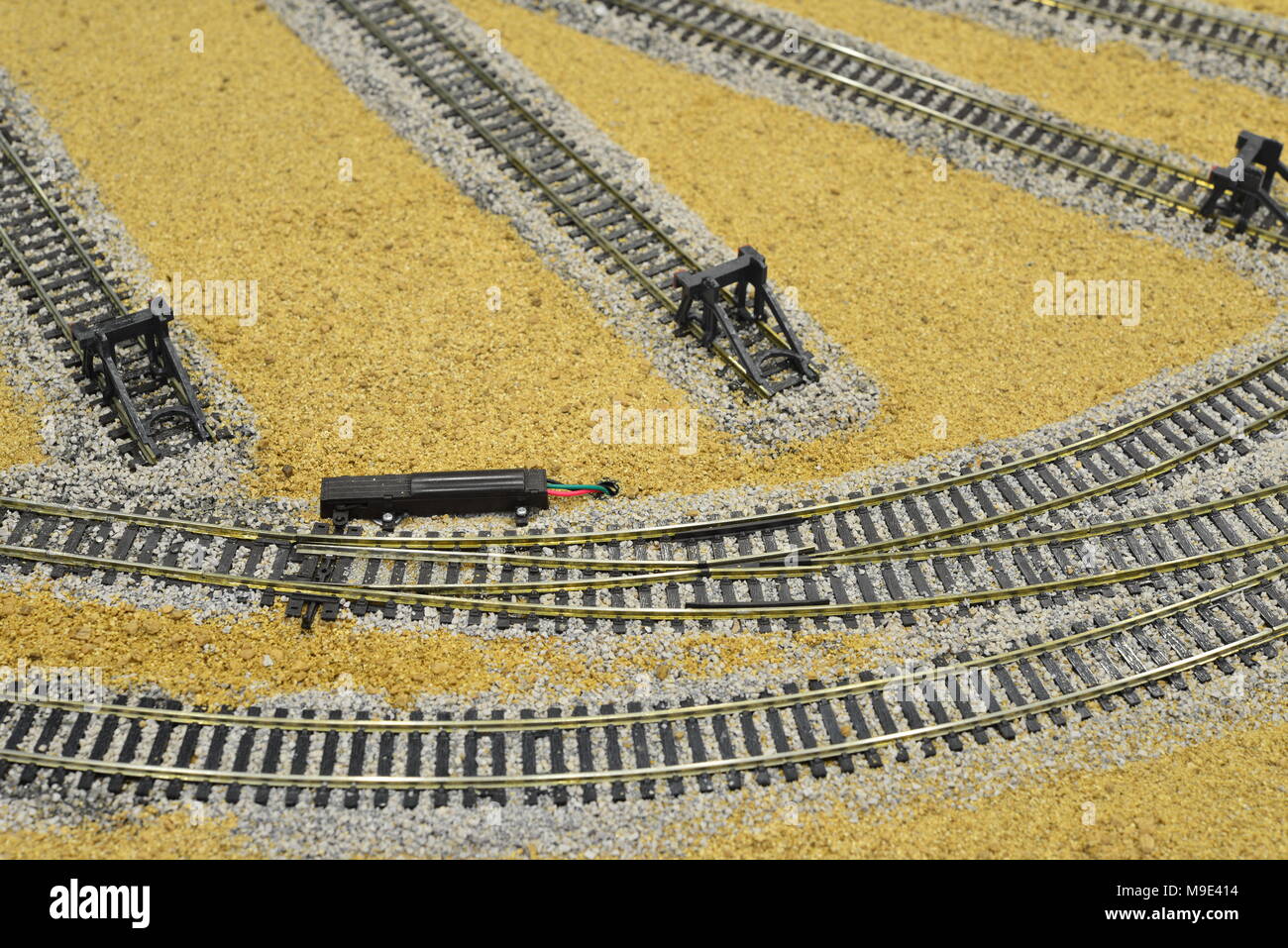Electric points on a model railway desert landscape Stock Photo Alamy