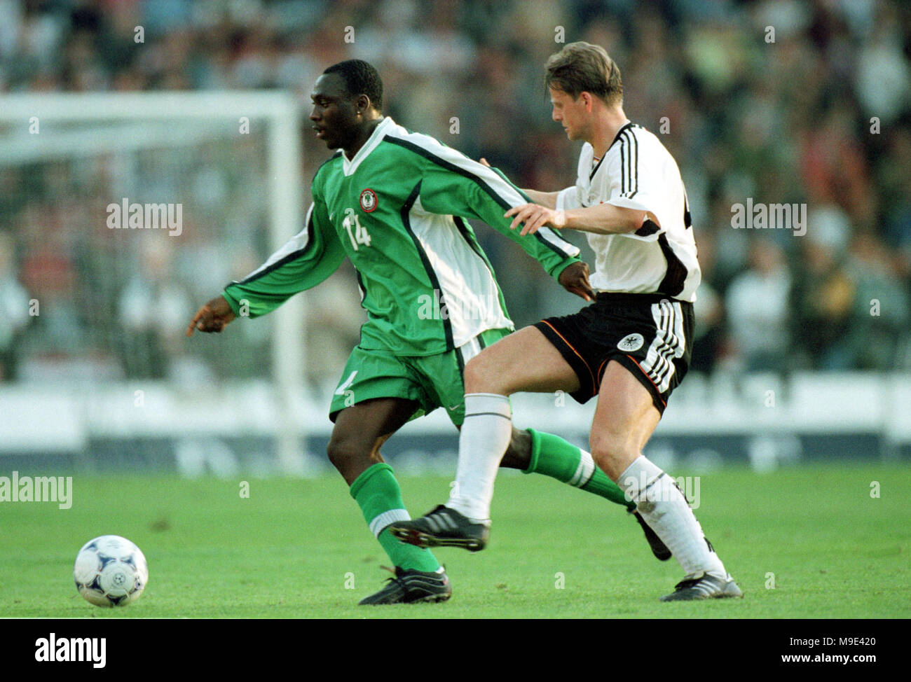 Mungersdorfer Stadion Cologne, Germany  22.4.1998, Football International Friendly, Germany vs Nigeria 1:0 ---- Daniel AMOKACHI (Nigeria), Christian WOERNS Stock Photo