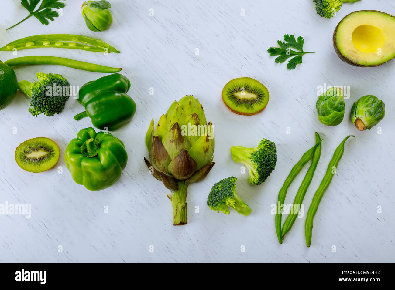 Green vegetables on wooden background top view workplace cook with ...