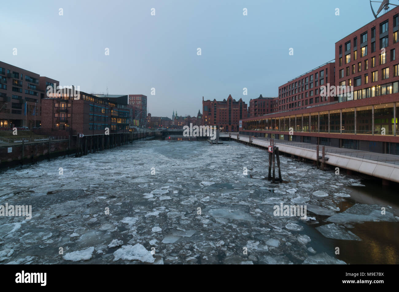 Hamburg, Germany - March 04, 2014: View from Magdeburger bridge at Magdeburger Hafen and International Maritime Museum Hamburg with ice sheets at Elbe Stock Photo