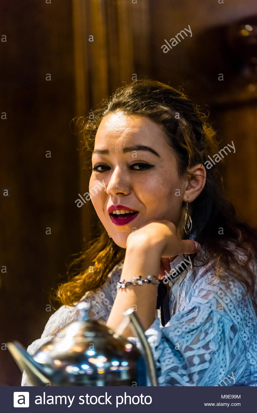 A Uyghur Woman Eating Lunch Urumqi Xinjiang Province China