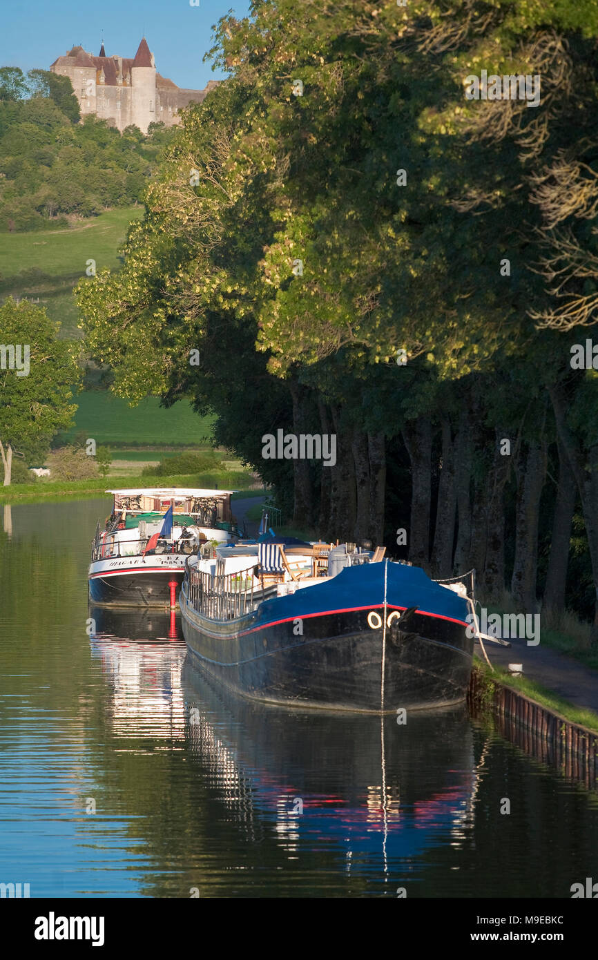 France, Cote d'Or, Burgundy, Barges tied to bank of Burgundy Canal, Chateauneuf en Auxois Stock Photo