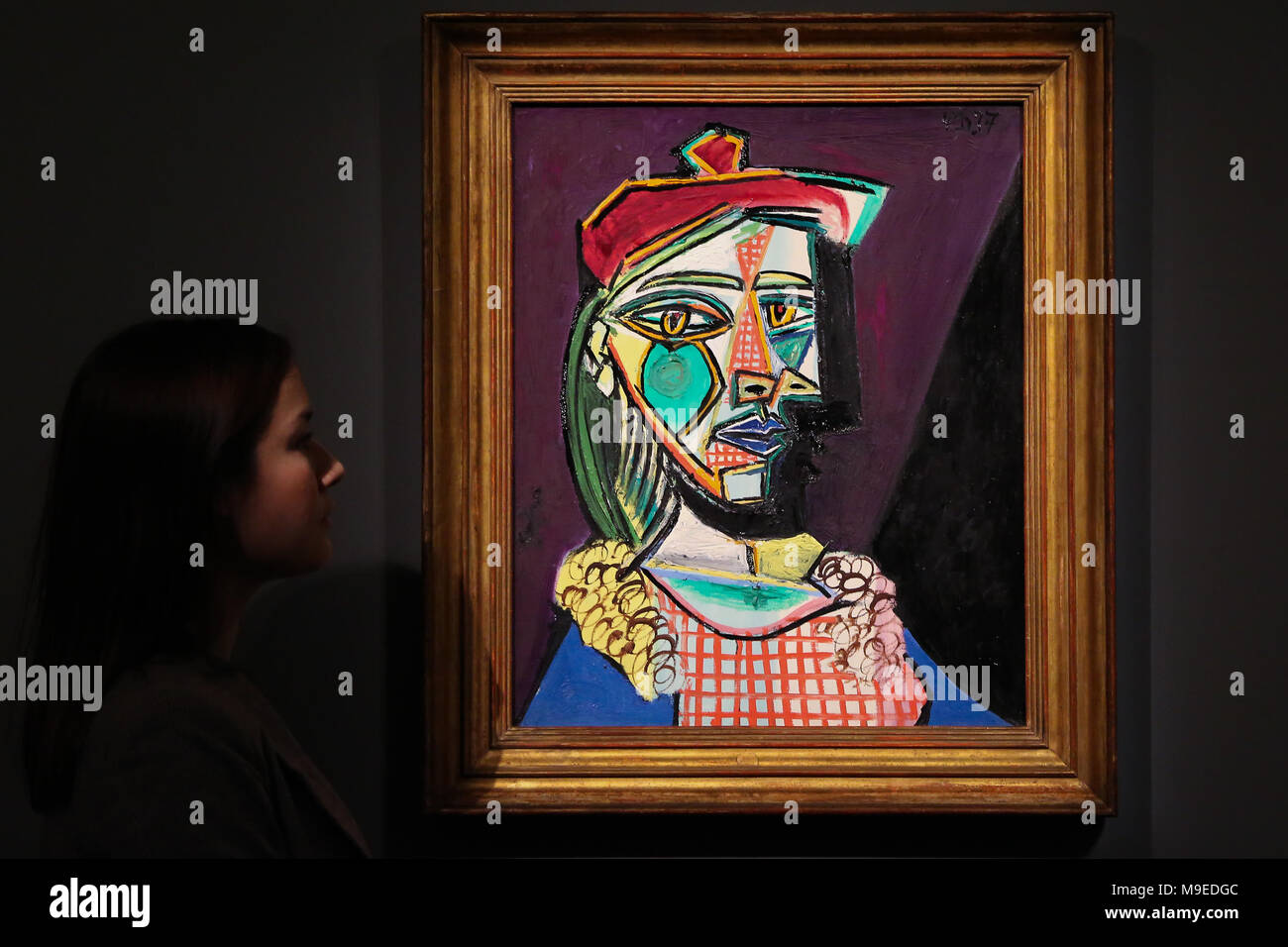 Major works of impressionist modern surrealist contemporary art work on display for auction at Sotherby s Featuring A Technician hangs Pablo Picasso s Femme au beret et a la robe quadrille Maria Ther...