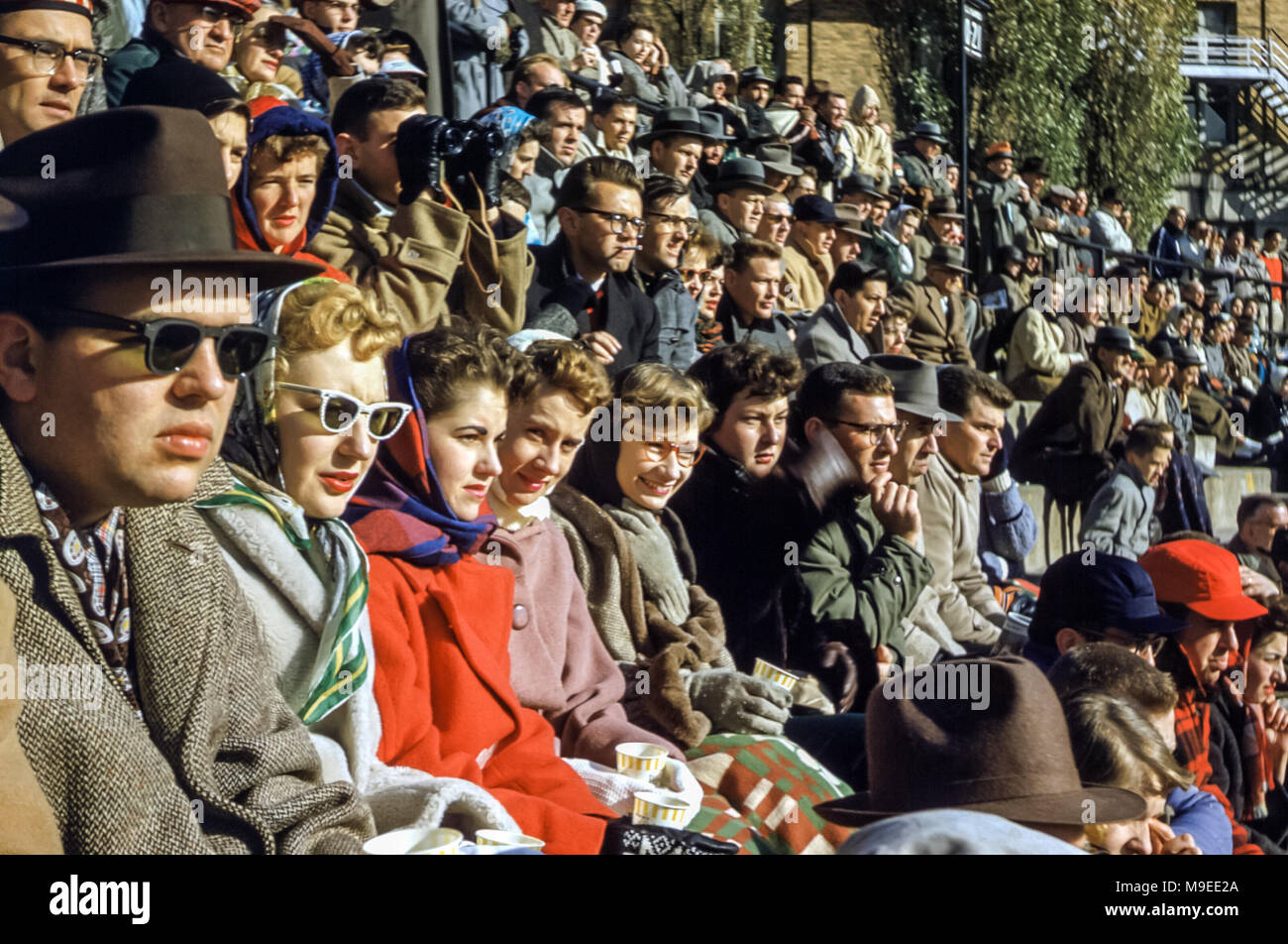 Crowd in stadium seated watching Syracuse University American football game, New York, USA in 1950s Stock Photo